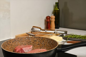 Frying top sirloin beef steak in the kitchen