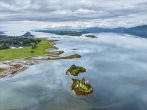 Aerial view of the 14th century island castle Castle Stalker in Loch Laich