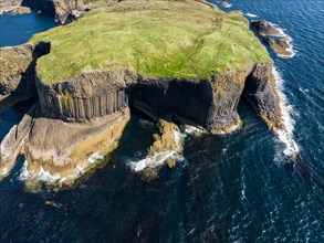 Aerial view of the uninhabited rocky island of Staffa with the prominent basalt columns and Fingal's Cave