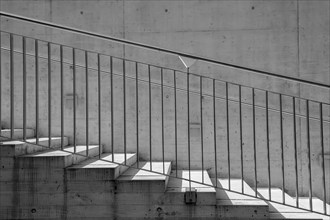 Modern Staircase and Railing in Concrete and Metal with Sunlight in Lugano