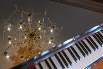 Crystal Lamp Reflected on a Piano in Switzerland