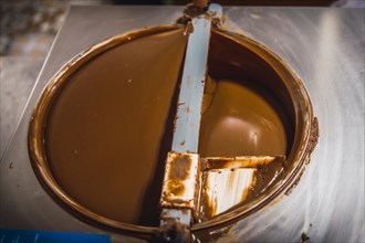 Making the liquid Natural Chocolate Cocoa circling on Roatan Island. Honduras