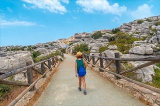 A young woman trekking in the Torcal de Antequera next to the viewpoint