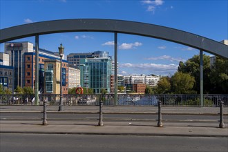 Bridge arch of the Lessingrbuecke with the office complexes at the Spreebogen