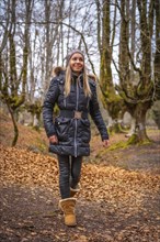 A young woman on the path in the Otzarreta Forest in the Gorbea Natural Park