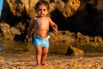 A boy on summer vacation at Praia dos Arrifes