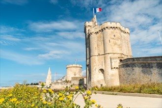 The beautiful fort and Saint Nicolas Tower of La Rochelle in summer. Coastal town in southwestern France