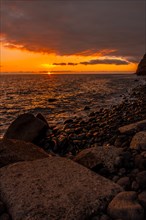 Orange sunset on the beach of Puerto de Tazacorte on the island of La Palma