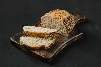 Artisan bread with sunflower and sesame seeds cut on slices