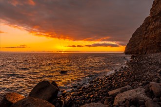 Orange sunset on the beach of Puerto de Tazacorte on the island of La Palma