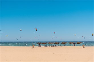 Kitesurf sport on the Canos de Meca beach on the Costa de la Luz