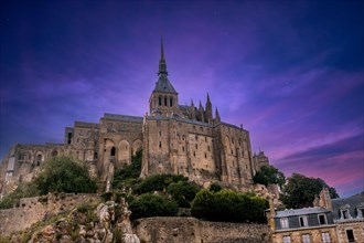 The famous Mont Saint-Michel Abbey at night in the Manche department