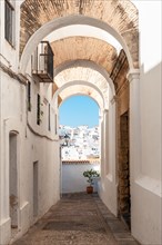 Arches and white houses in the historic center of Vejer de la Frontera