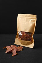 Dehydrated lamb jerky in paper package