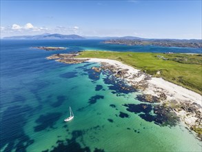 Aerial view of Traigh An T-Suidhe sandy beach on the north side of the Isle of Iona