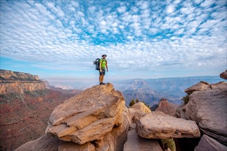 A young man on a viewpoint of the descent of the South Kaibab Trailhead. Grand Canyon