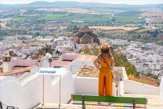 A tourist looking at the tourist town of Arcos de la Frontera in Cadiz