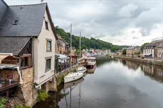 Houses and boats on the Rance river in Dinan medieval village in French Brittany