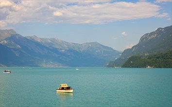 Mountain on Lake Brienz with Boats in a Sunny Day in Interlaken