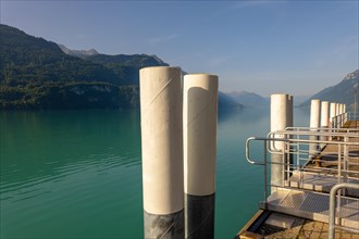Harbor with Columns and View over Lake Brienz with Mountain and Sunlight in Brienz