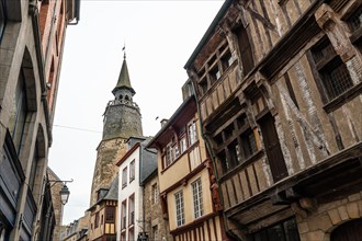 Lovely wooden houses in the old town of Dinan and its medieval castle along the Rance river in French Brittany