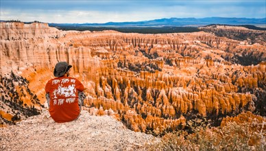 A young man watching the national park from Bryce Point
