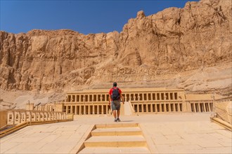 A young woman visiting the Mortuary Temple of Hatshepsut without people on her return from tourism in Luxor after the coronavirua pandemic