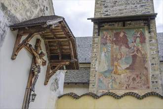 Cross and fresco at the parish church of St.Pankraz