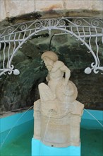Sculpture with market fountain at the grotto