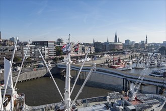 View of Niederhafen harbour and the museum ship Cap San Diego at the Ueberseebruecke bridge in the Port of Hamburg from a cruise ship