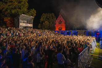 Crowd at Live Klostersommer Festival in Historic Monastery