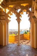 Watching the sunset from the Arab doors of a courtyard of the Alcazaba in the city of Malaga