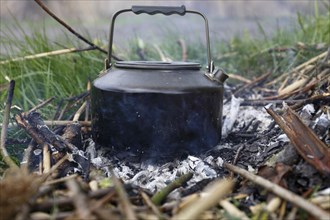 Preparing food on a campfire