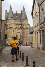 A young tourist at the medieval castle of Vitre. Ille-et-Vilaine department