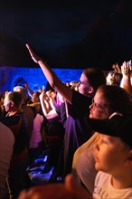 Crowd at Live Klostersommer Festival in Historic Monastery in front of stage