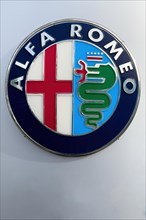 Logo of the Italian car manufacturer Alfa Romeo with elements of the coat of arms of Milan