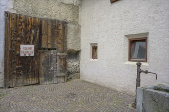 Original wooden garage door and well