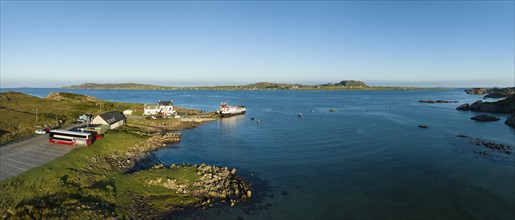 Aerial panorama of the Fionnphort ferry terminal with the ferry MV Loch Buidhe of the Caledonian MacBrayne shipping company operating a scheduled service between Fionnphort and the Isle of Iona