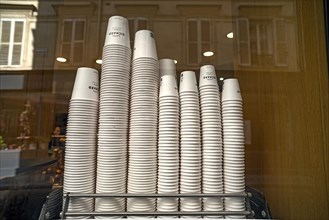 Stacked paper cups for coffee to go in a cafe