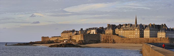 View over the walled city Saint-Malo from mole at sunset