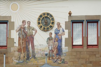 Sundial and mural at the town hall