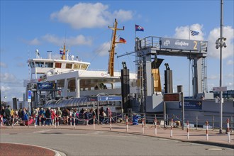 People waiting in line at the island ferry Norderney