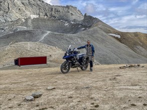 Man with motorbike BMW R1200 GS Adventure at Colle Sommeiller