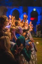 Cheering crowd at Live Klostersommer Festival in Historic Monastery