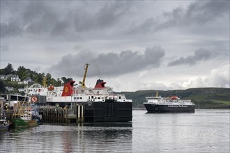 The ferries Isle of Mull and Isle of Lewis of the shipping company Caledonian MacBrayne in the ferry port of Oban