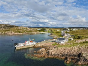 Aerial view of the Fionnphort ferry terminal with the ferry MV Loch Buie of the shipping company Caledonian MacBrayne operating a scheduled service between Fionnphort and the Isle of Iona