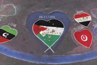 Palestinian flag painted as a heart on the street