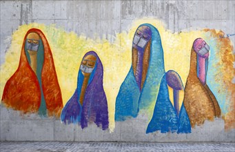 Mural of women in colorful abayas by Nada Khozestani