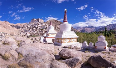 Stupas in front of Chemrey Gompa