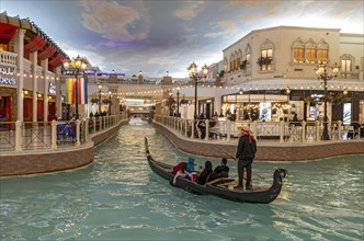 Gondola ride on indoor canal at Villaggio Mall